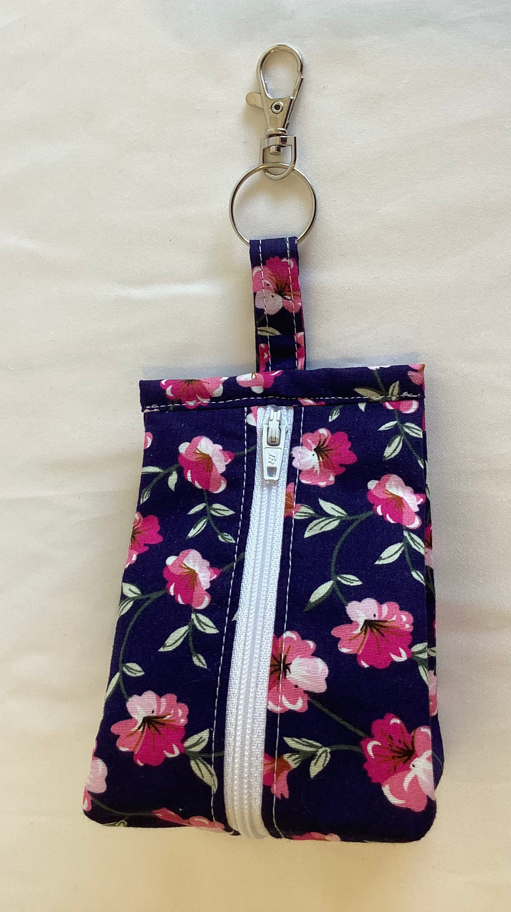 Purple Flowered Triangular Zipped Coin/Key Pouch With a Lobster Claw Clasp