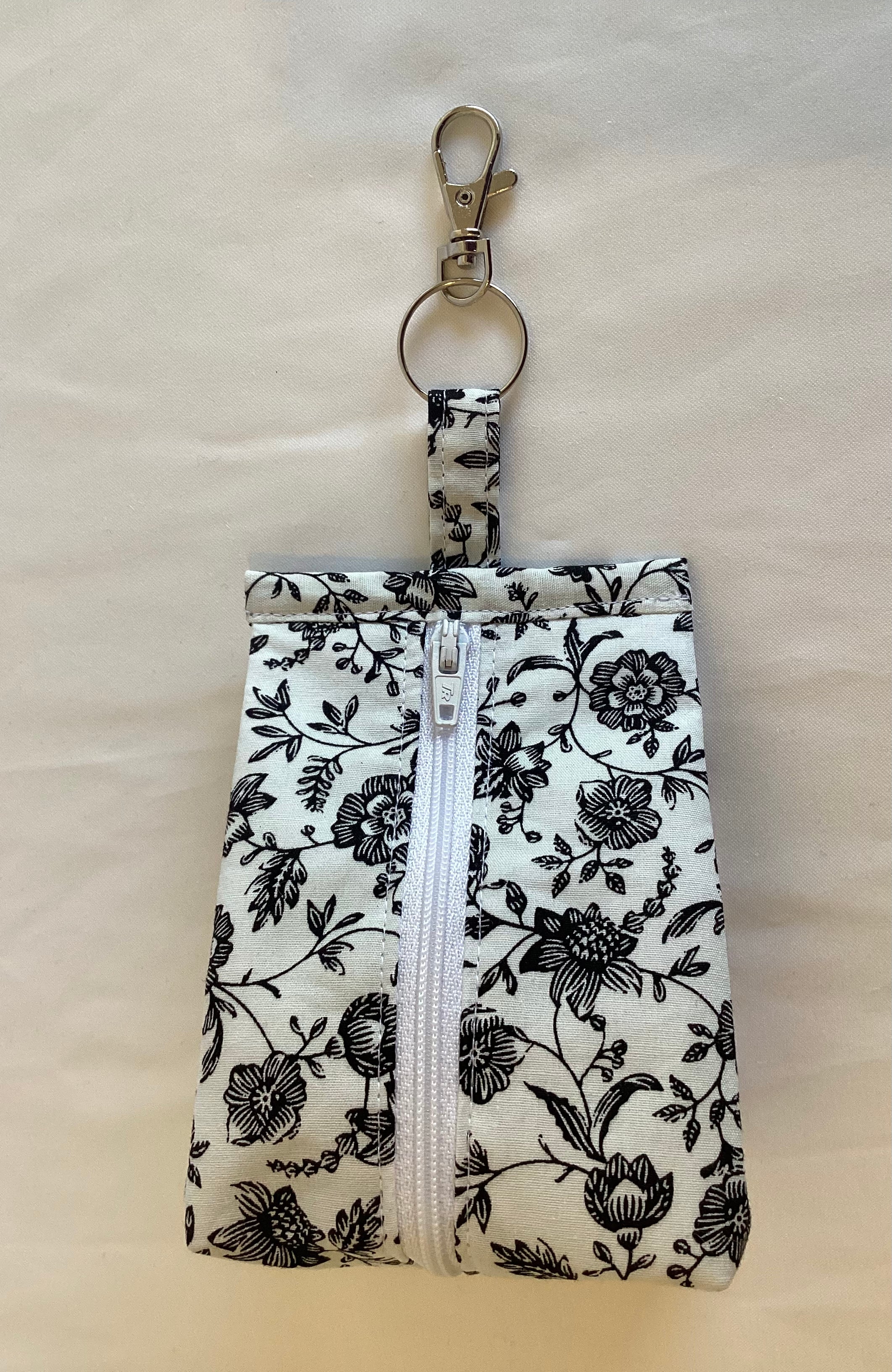 White With Black Flowers Triangular Zipped Coin/Key Pouch With a Lobster Claw Clasp